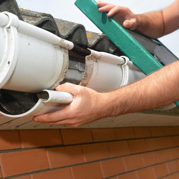 Gutter repair in Doncaster by Roofing Guys Melbourne, replacing cracked gutter joins and restoring proper rainwater flow.
