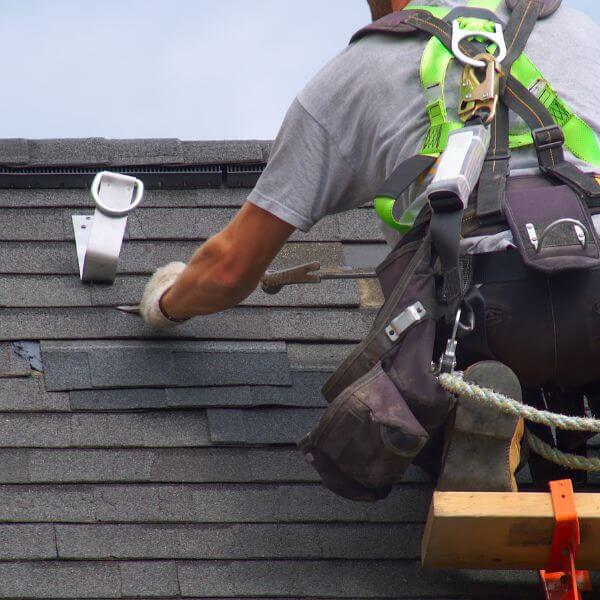 Roofer from Roofing Guys Melbourne replacing cracked and lifted shingles during a detailed roof repair. Roofer from Roofing Guys Melbourne replacing cracked and lifted shingles during a detailed roof repair.