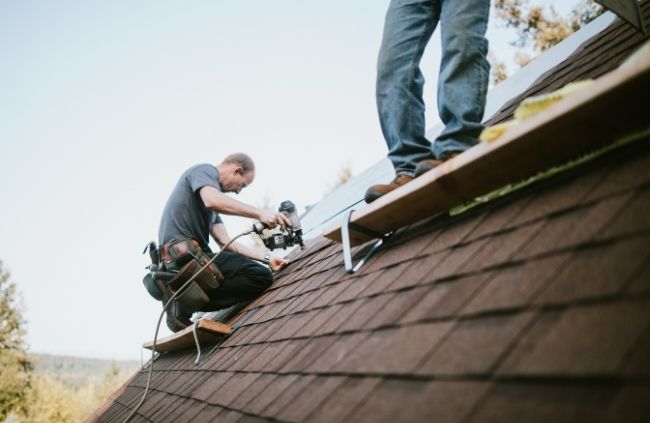 Roof restoration in Melbourne with Roofing Guys specialists replacing roof shingles and restoring structural strength.