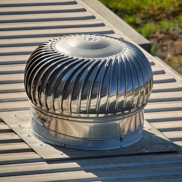 Roofing Guys Melbourne whirlybird installation on a residential metal roof to enhance airflow and control moisture.